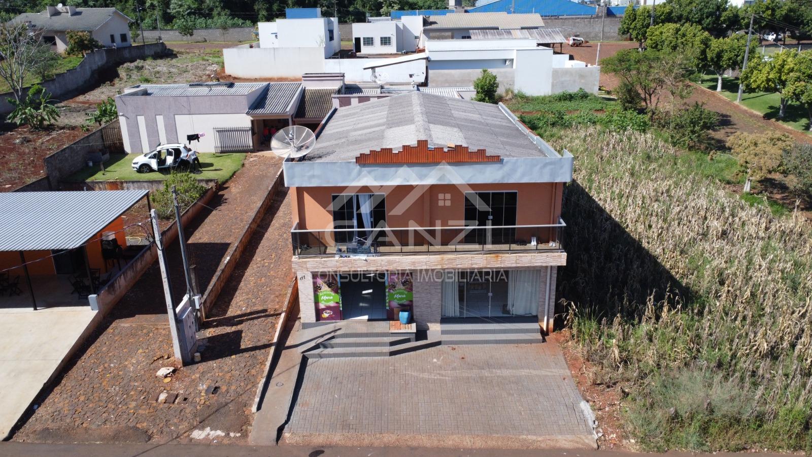 Vende-se Imvel contendo Prdio com 02 apartamentos, 02 Salas Comerciais e Casa.
